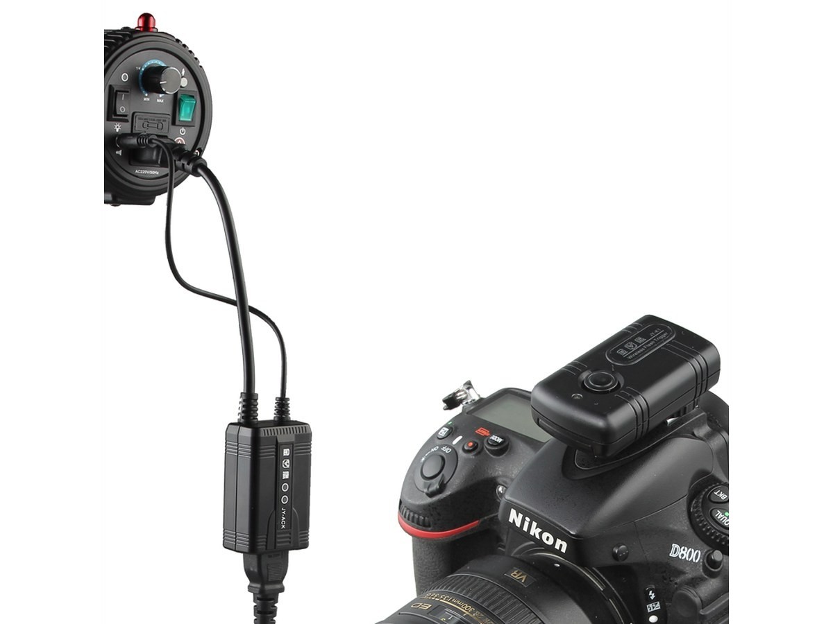Trigger firing a studio flash from the camera hot shoe