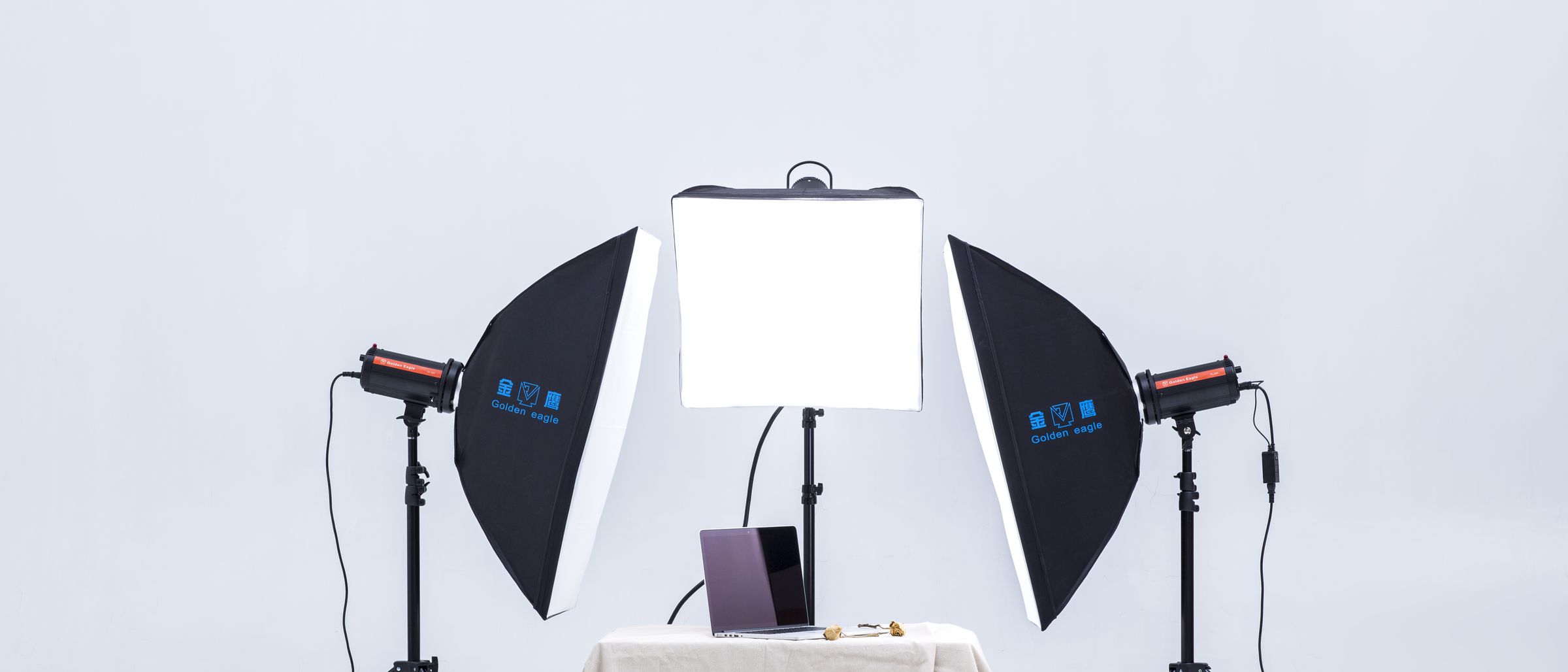 FX flash kit with three softboxes around a shooting table